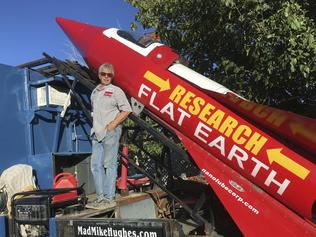 In this Wednesday, Nov. 15, 2017, photograph, daredevil/limousine driver Mad Mike Hughes is shown with with his steam=powered rocket constructed out of salvage parts on a five-acre property that he leases in Apple Valley, Cal. Hughes plans to launch his homemade contraption on Saturday near the ghost town of Amboy, Cal., at a speed of roughly 500 miles-per-hour. (Waldo Stakes/HO courtesy of Mad Mike Hughes via AP)