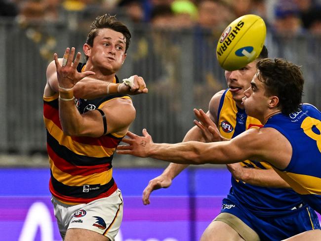 PERTH, AUSTRALIA - AUGUST 26: Matt Crouch of the Crows handpasses the ball during the 2023 AFL Round 24 match between the West Coast Eagles and the Adelaide Crows at Optus Stadium on August 26, 2023 in Perth, Australia. (Photo by Daniel Carson/AFL Photos via Getty Images)