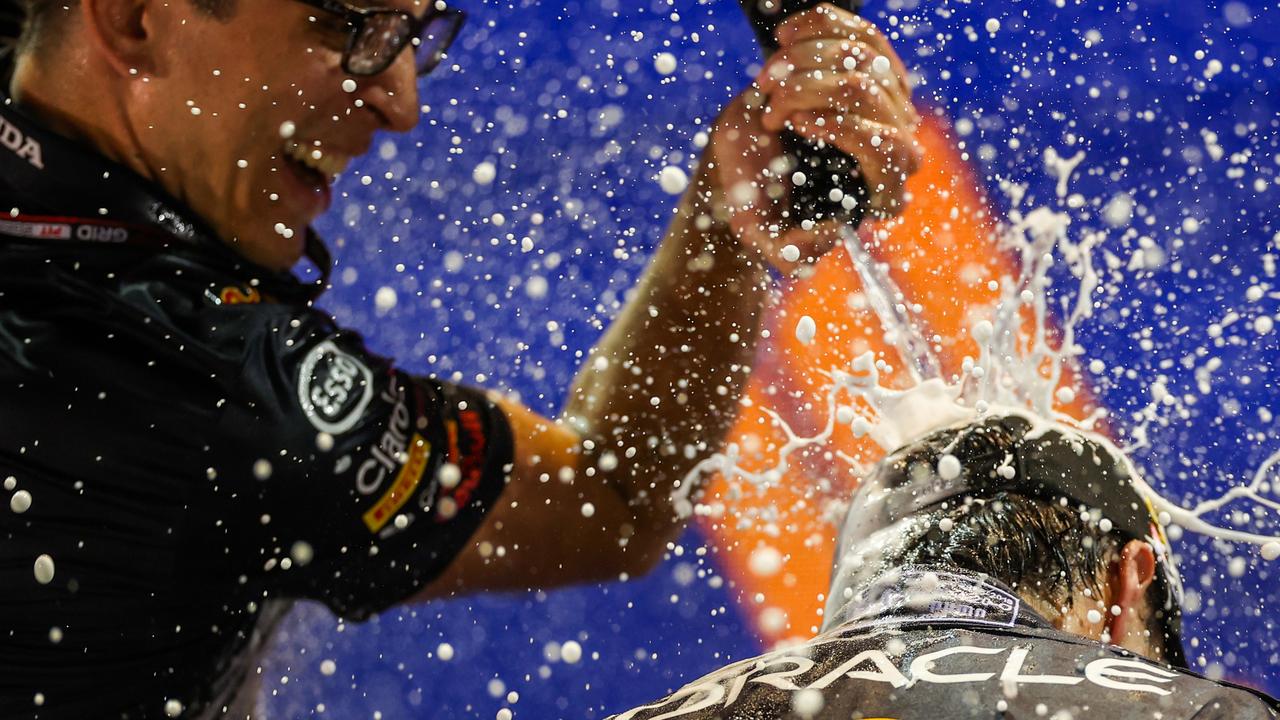 Sergio Perez of Mexico and Red Bull Racing celebrates finishing in first position