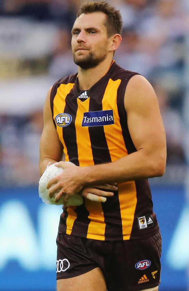 Luke Hodge with his forearm bandaged with ice after Hawthorn’s loss to Geelong. Picture: Getty Images