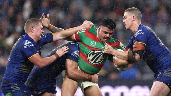 SYDNEY, AUSTRALIA - JULY 04: Latrell Mitchell of the Rabbitohs is tackled during the round 18 NRL match between Parramatta Eels and South Sydney Rabbitohs at CommBank Stadium, on July 04, 2024, in Sydney, Australia. (Photo by Cameron Spencer/Getty Images)