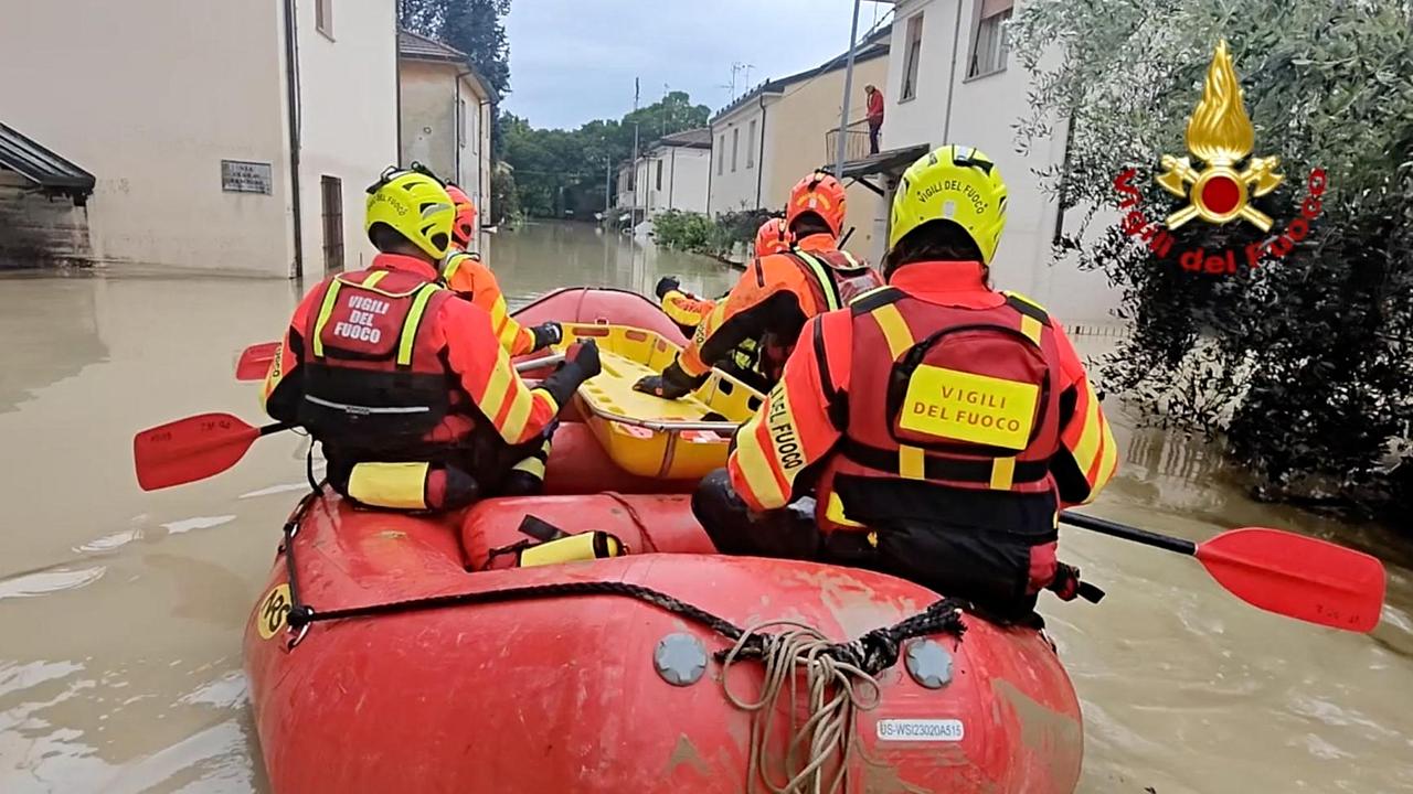 Firefighters in a flooded street in Faenza, where the AlphaTauri team is based. (Photo by Handout / Vigili del Fuoco / AFP)