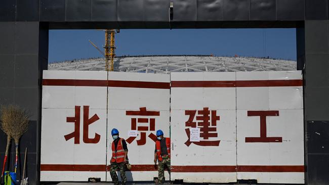 Workers at the construction site of a planned venue of the 2023 Asian Cup. The Chinese government is pumping providing monetary and fiscal stimulus at a time when the rest of the world is struggling with inflation. Picture: Jade Gao/AFP