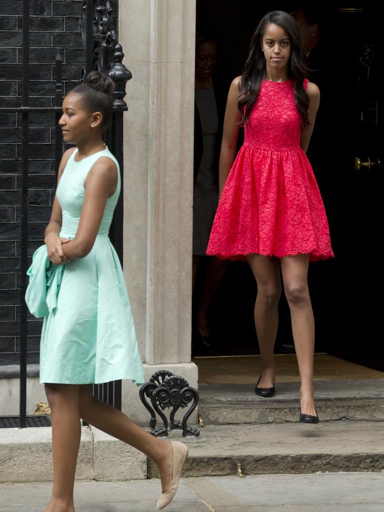 Malia, right, and Natasha, the daughters of US First Lady Michelle Obama, leave after joining their mum to visit British Prime Minister David Cameron and his wife Samantha at 10 Downing Street, in London, Tuesday, June 16, 2015. Picture: AAP