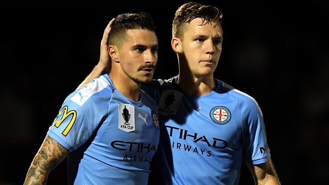 Melbourne City’s Jamie Maclaren is congratulated by teammate Scott Galloway after scoring a goal against Brisbane Strikers Picture: AAP
