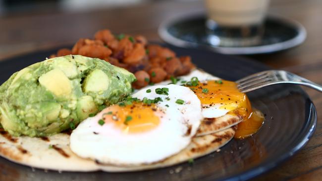 Breakfast at BSKT Cafe, Miami. Navajo Native Breakfast/ Fried Free Range eggs, BSKT Beans, Avocado & Tomato Salsa with Basil Essential oil on Native Flat Bread. Photo: Kit Wise