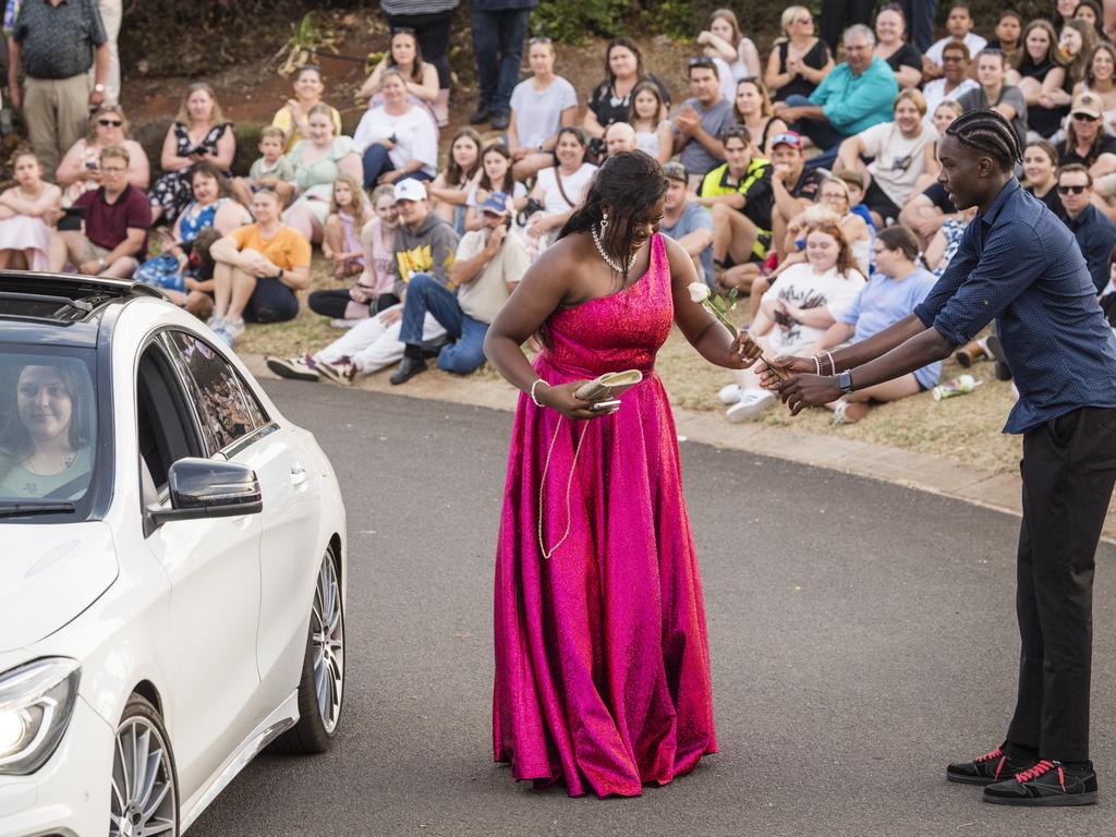 Tadiwanashe Mutomba receives a flower at Harristown State High School formal at Highfields Cultural Centre, Friday, November 17, 2023. Picture: Kevin Farmer