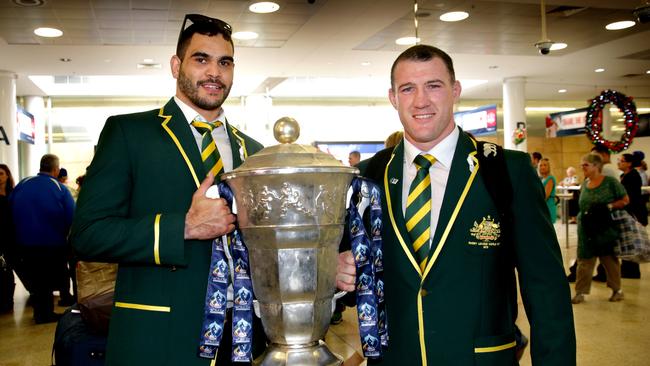 Paul Gallen and Greg Inglis with the World Cup trophy after arriving back with the World Champion Kangaroo rugby league team at Sydney Airport , Mascot.Picture Gregg Porteous