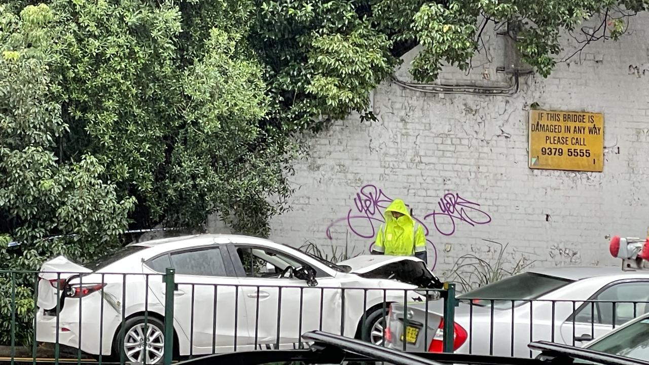 The car that was found abandoned in the creek, shortly before it was towed away on the Cumberland Highway.