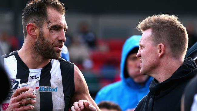 Travis Cloke chats to coach Nathan Buckley after being dropped to the VFL.