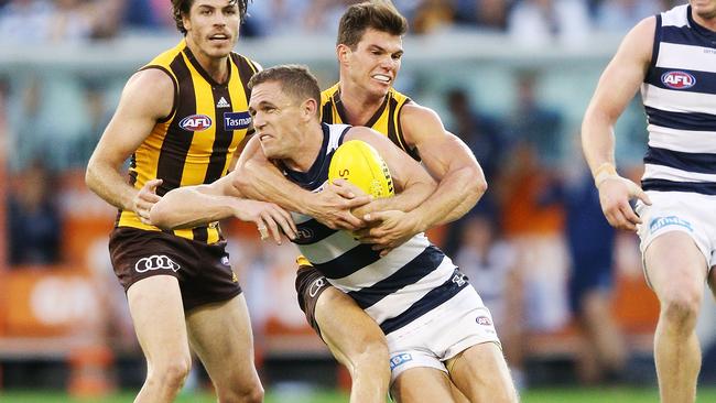 Joel Selwood raises his arm in an attempt to win a free kick for too high. Picture: Getty