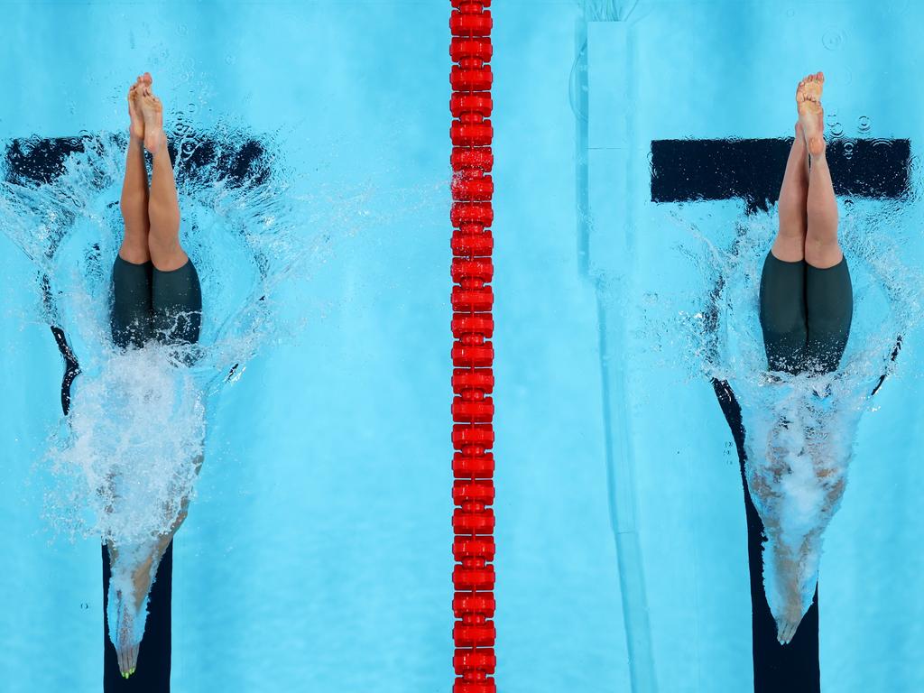 Ariarne Titmus (left) and Mollie O'Callaghan compete in the women’s 200m freestyle semi-finals. Picture: Getty Images