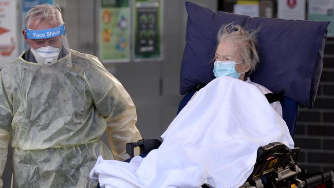 A resident is evacuated from Epping Gardens Aged Care Home on Thursday. Picture: Andrew Henshaw