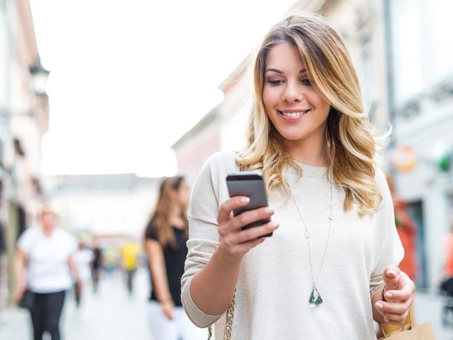 Attractive woman finding shopping deals online.