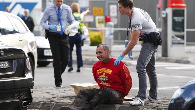 Toby Mitchell being arrested during a search at the South Melbourne Market in 2013.