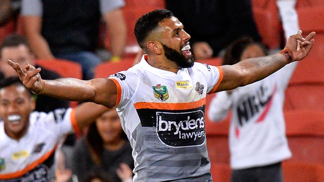 Josh Addo-Carr celebrates scoring a try during the round 12 NRL match between the Brisbane Broncos and the Wests Tigers at Suncorp Stadium.