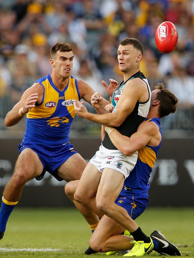 Robbie Gray gets a handball away under pressure against the Eagles. Picture: Paul Kane/Getty Images