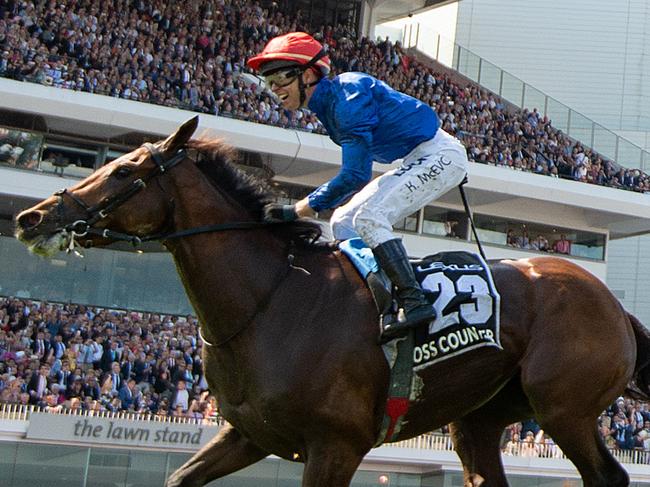 Kerrin McEvoy rides Cross Counter (left) to victory in race 7, the Lexus Melbourne Cup, during the Lexus Melbourne Cup Day, as part of the Melbourne Cup Carnival, at Flemington Racecourse in Melbourne, Tuesday, November 6, 2018. (AAP Image/Albert Perez) NO ARCHIVING, EDITORIAL USE ONLY