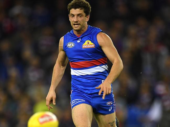 Tom Liberatore of the Bulldogs is seen in action during the Round 13 AFL match between the Western Bulldogs and the Melbourne Demons at Etihad Stadium in Melbourne, Sunday, June 18, 2017. (AAP Image/Julian Smith) NO ARCHIVING, EDITORIAL USE ONLY