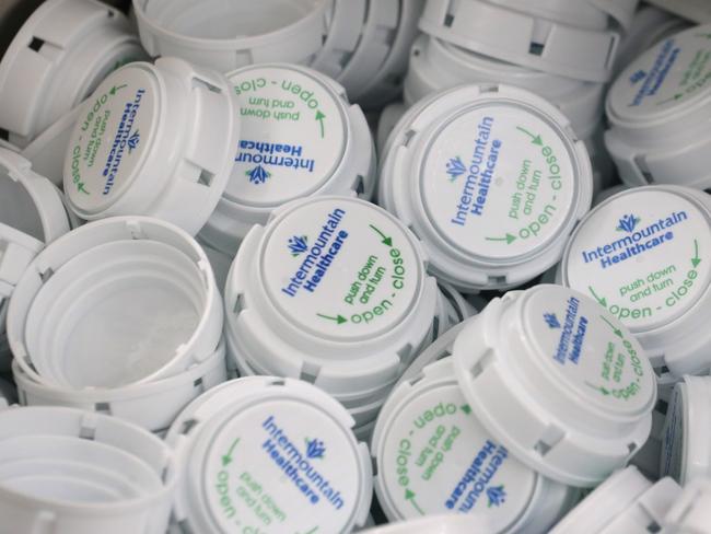 MIDVALE, UT - SEPTEMBER 10: A box of prescription bottle caps lay in a box ready to be used for an automated line at the central pharmacy of Intermountain Heathcare on September 10, 2018 in Midvale, Utah. IHC along with other hospitals and philanthropies are launching a nonprofit generic drug company called "Civica Rx" to help reduce cost and shortages of generic drugs.   George Frey/Getty Images/AFP == FOR NEWSPAPERS, INTERNET, TELCOS & TELEVISION USE ONLY ==