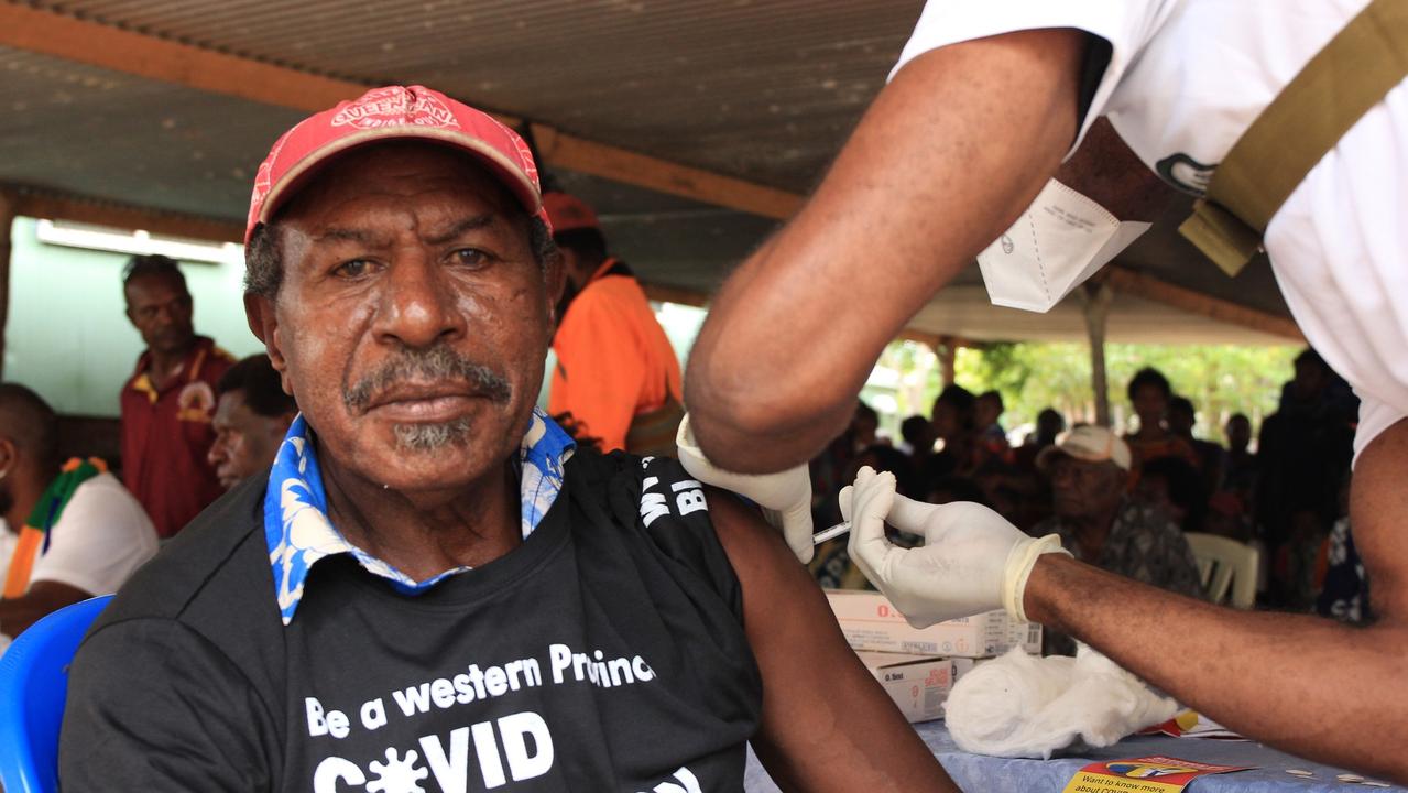 Salee Keeget Kebie from PNG Western Province village of Sigabaduru gets a Covid-19 vaccine.