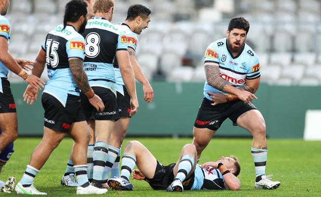 Braden Hamlin-Uele stands over Jack Williams after pretending to knock him out as part of his post try celebration (Photo by Mark Kolbe/Getty Images)