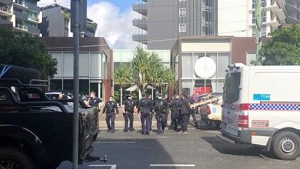 Police break up a “protest’’ at a Newstead business during the Queensland lockdown.