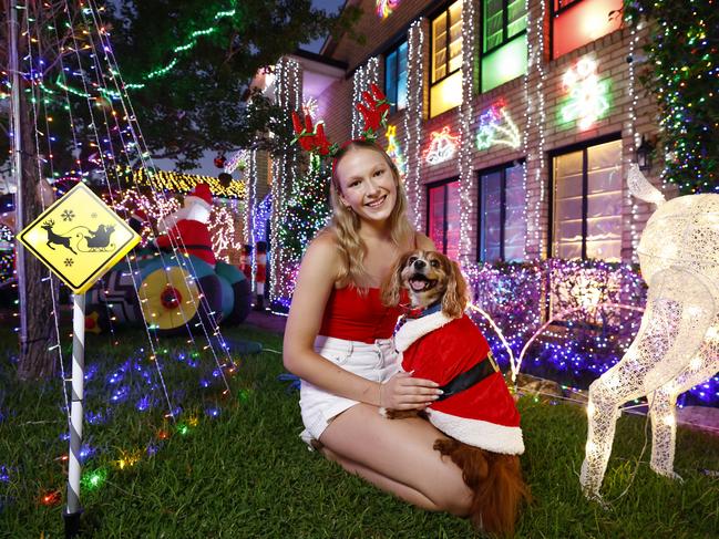 Amber Augustus with dog Apollo outside her North Ryde home. Picture: Jonathan Ng