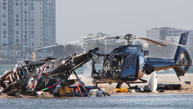 The wreckage of two helicopters which collided on Monday afternoon near Sea World above the Broadwater. One crashed and the pilot of the other managed to steady it and land. Picture: Glenn Hampson