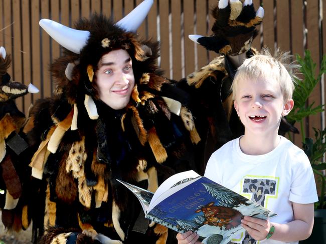 The Gruffalo acts up with 5 year old Jake Townsley of Mt Gravatt at Where the Wild Things Are bookstore, West End. Picture: Renae Droop