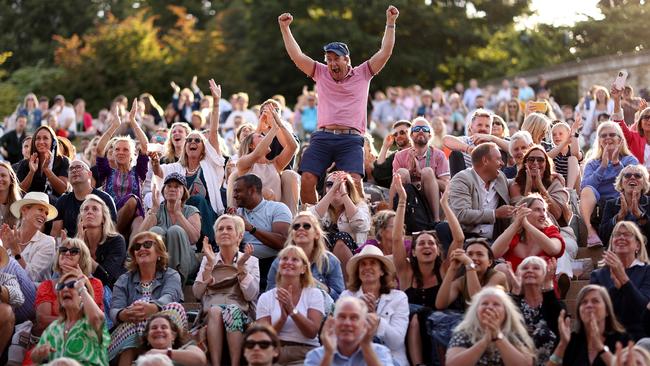 Spectators watch the big screens from The Hill during the Men's Singles Quarter Final match showcasing Cameron Norrie of Great Britain. Photo by Ryan Pierse/Getty Images.