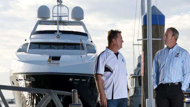 Southport Yacht Club General Manager Brett James (right) and Waterfront Manager Mark Riddell talking about the superyacht inundation for Commonwealth Games. Photo: Steve Holland