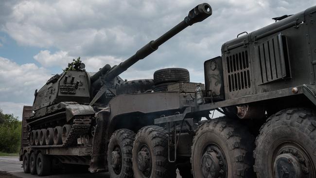 A Ukrainian Army howitzer loading on a tank transporter near Bakhmut, eastern Ukraine. Picture: AFP