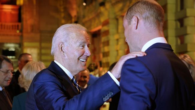 US President Joe Biden greets Britain's Prince William as they arrive to attend an evening reception to mark the opening day of the COP26 summit in Glasgow. Picture: Alberto Pezzali – Pool/Getty Images