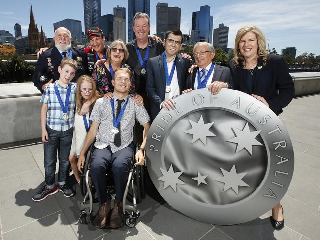 Victorian Pride of Australia award winners (L-R from back row) CFA officer Paul Bannan, Michael Gallus, Jude Donahoo, Neale Daniher, Jonathan Tarascio, Kevin Costa (standing for winner Simon Costa, (L-R front) brother and sister Hayden and Stephanie Rujak, Beau Vernon and Chairman Herald and Weekly Times Penny Fowler. Picture: David Caird