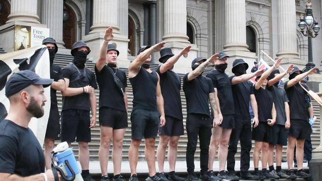 A far right wing group did Nazi salutes on the steps of the Victorian Parliament. Kellie-Jay Keen denies any links to the group, and blamed the police for letting the neo-Nazis to gather at an angle to be caught in the same photographs as herself. Picture: NCA NewsWire/David Crosling