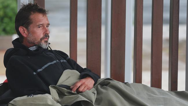 Gold Coast starting to feel the wrath of Cyclone Alfred, lur king just off the coast. Homeless man Nico Jones shelters from the weather in his swag at Surfers Paradise. Picture Glenn Hampson