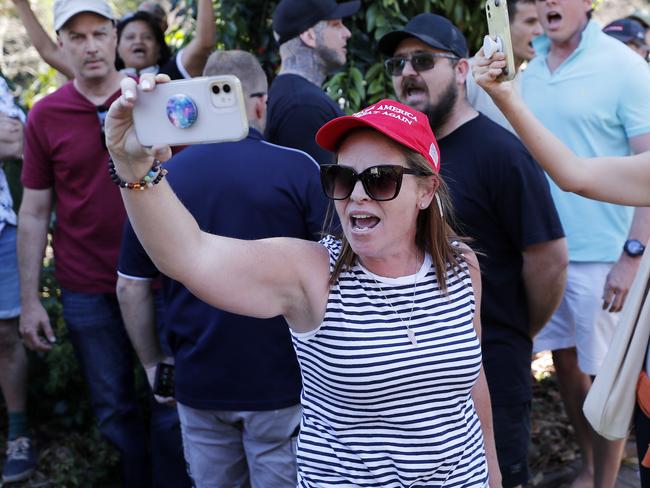 A protester films the incident. Picture: NCA NewsWire / Josh Woning