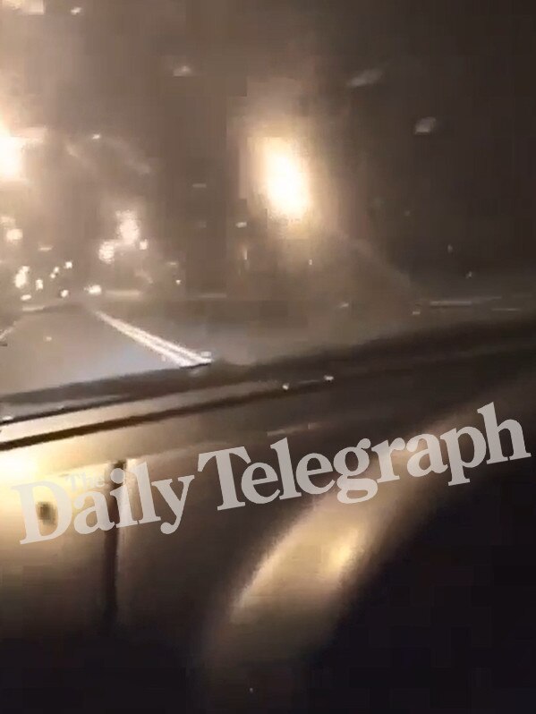 This video still shows the car swerving over double-unbroken lines towards a large median strip. Picture: Snapchat