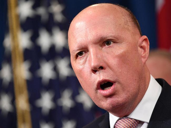 (FILES) A file photo taken on March 5, 2020 shows Australia's then-Home Affairs Minister Peter Dutton during a press conference at the Department of Justice in Washington, DC. - Dutton, who became Australia's new defence minister on March 29, 2021, is a hardline ex-cop who has overseen a controversial refugee policy, riled close ally New Zealand by deporting criminal Kiwis and publicly clashed with the Chinese government. (Photo by Mandel NGAN / AFP)