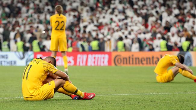 Australia's players react to their defeat during the 2019 AFC Asian Cup quarter-final football match between UAE and Australia at Hazaa bin Zayed Stadium in Al-Ain on January 25, 2019. - UAE defeated Australia 1-0. (Photo by Karim Sahib / AFP)