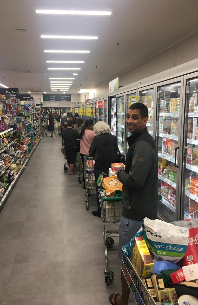 50-metre lines at Woolworths as coronavirus shopping panic escalates. Picture: Twitter