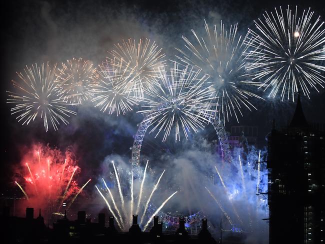 Fireworks explode over The Coca-Cola London Eye, Westminster Abbey and Elizabeth Tower near Parliament. Picture: Getty