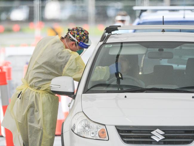 ADELAIDE, AUSTRALIA - NewsWire Photos JULY 01, 2021 -  Lines of cars and health workers at the Victoria Park Covid testing clinic in Adelaide. Picture: NCA NewsWire / Brenton Edwards