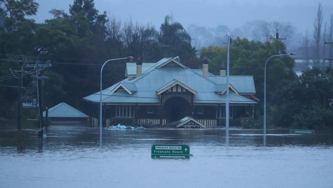 The river level has dropped overnight, but Windsor Bridge remains submerged. Picture: John Grainger