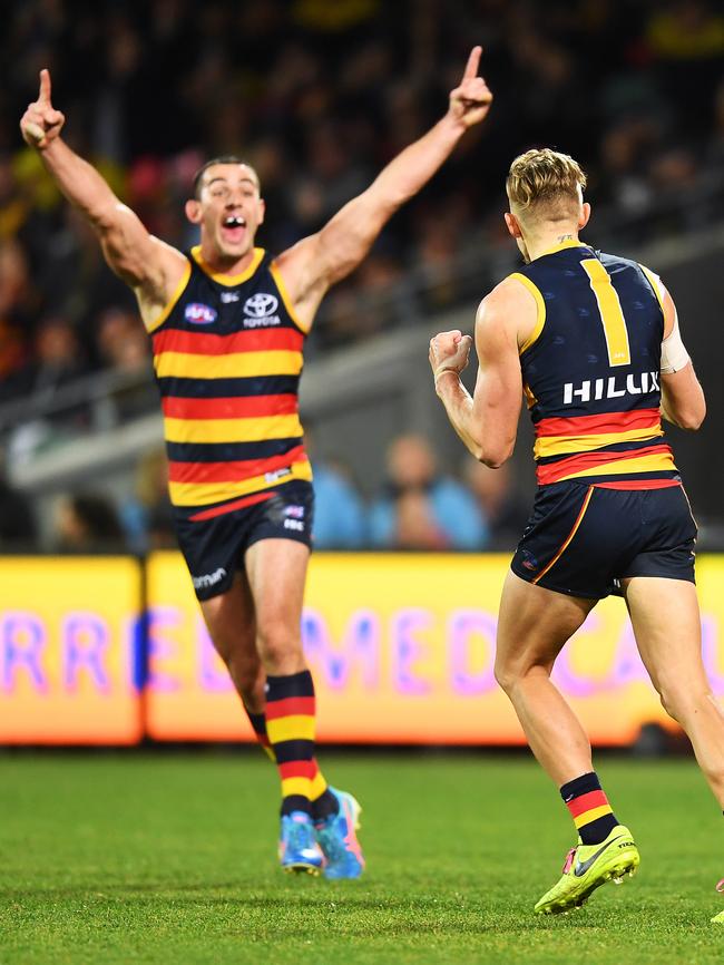 Taylor Walker celebrates a goal with Crows teammate Hugh Greenwood. Picture: AAP Image/Mark Brake