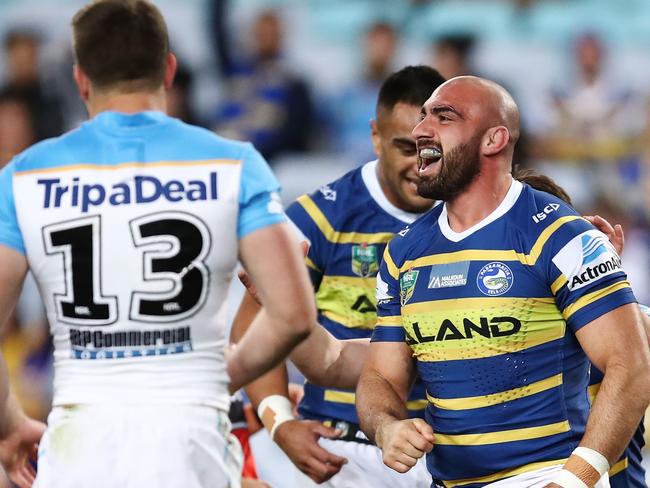 SYDNEY, AUSTRALIA - AUGUST 04:  Tim Mannah of the Eels celebrates with team mates after scoring a try during the round 21 NRL match between the Parramatta Eels and the Gold Coast Titans at ANZ Stadium on August 4, 2018 in Sydney, Australia.  (Photo by Brendon Thorne/Getty Images)