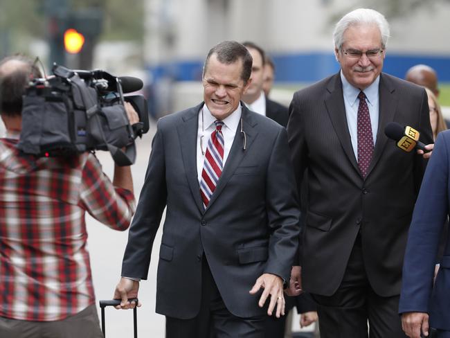 Attorneys for pop singer Taylor Swift, Douglas Baldridge, left, and Jesse P. Schaudies, Jr., are surrounded by photographers as they enter the federal courthouse. Picture: AP