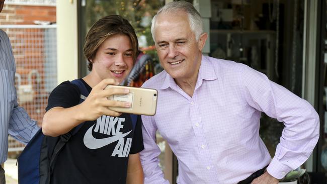 Australian Prime Minister Malcolm Turnbull takes a selfie with a supporter in Putney, Sydney on Sunday. Picture: AAP