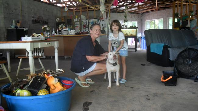 Tuesday February 4. Heavy rain causes flooding in North Queensland. Donna Lucker and granddaughter Dezire, 5, and Khaleesi at her son's home affected by floodwater from Bluewater Creek. Picture: Evan Morgan